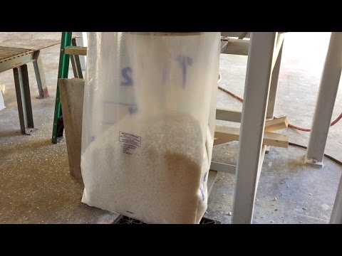 Bagging Coarse Solar Salt into Plastic Open Mouth Bags