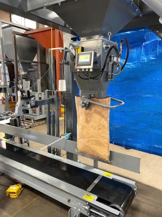 digital bagging machine attached to a buckhorn pro box discharge stand