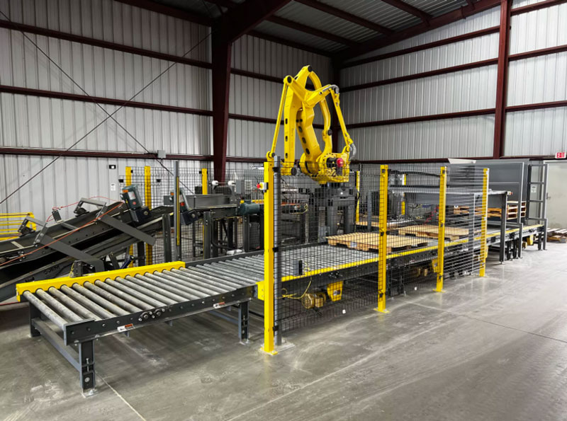 palletizing section of bagging system with automatic pallet dispenser