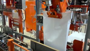 automatic bag placer hanging or positioning a bag on bagging scale