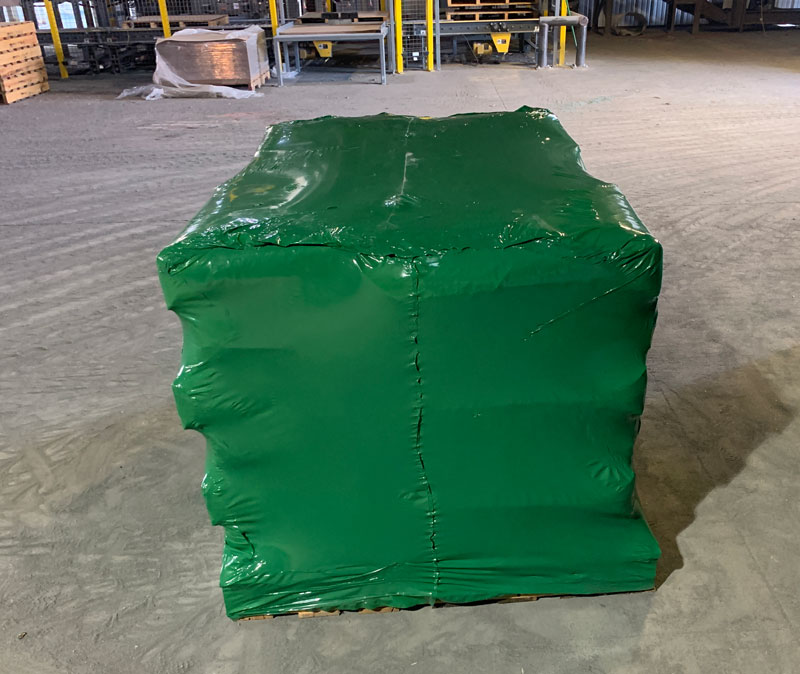 Shrink wrapped pallet of 100 lb. valve bags containing abrasive minerals