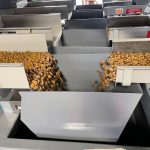 vibrating feeders filling internal weigh hopper with dog food and kibble