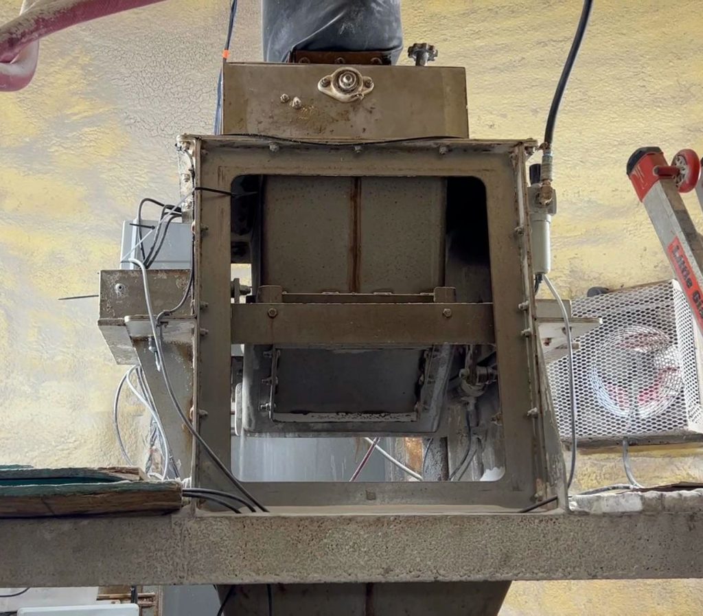 View of internal weigh hopper in net weigh bagging machine for salt