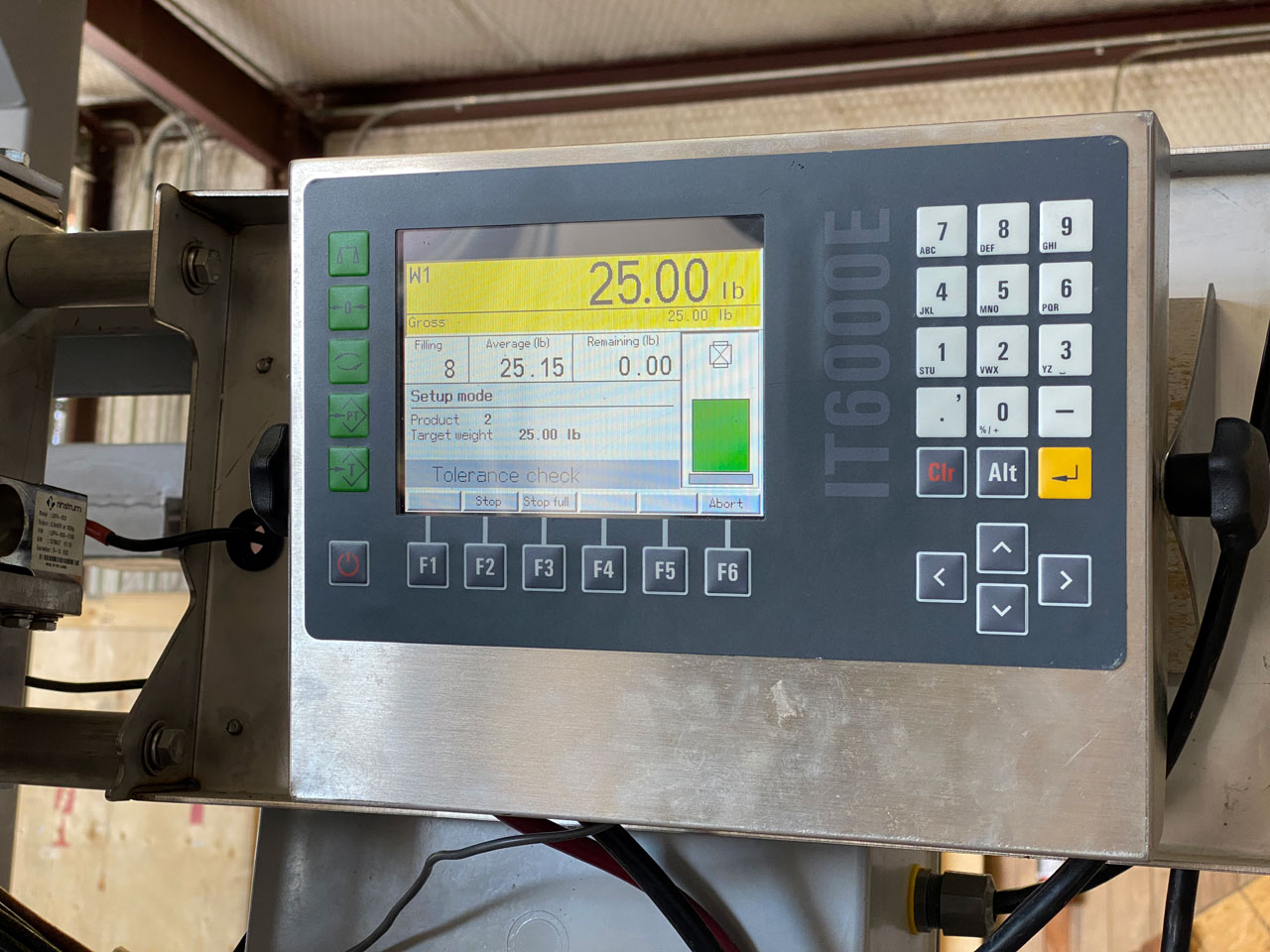 IT6000E batchweighing controller attached to bagging machine set target fill weight 25 lbs.