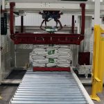 004-front-view-of-gantry-palletizer-system-bag-gripper-forming-cage