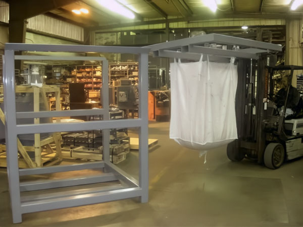 bulk tote bag suspended from bag lifting frame carried by fork truck