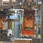 automatic-bag-placer-for-open-mouth-bags-of-deer-corn