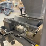 back view of small bag filling machine with vibratory feeder and weigh hopper