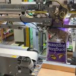 bag placing system for plastic bags filled with bird seed