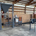 Model 350 DigitalPLUS Open Mouth Bagging Machine Attached to Hopper