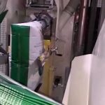 side view of valve bag on spout of automatic valve bag filling machine