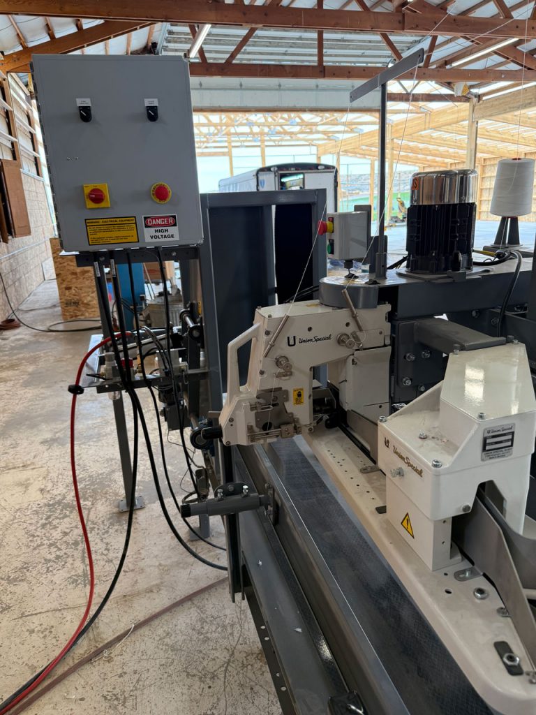 View of Union Special Bag Sewing Machine Conveyor Bag Kicker and Bagging System Controls