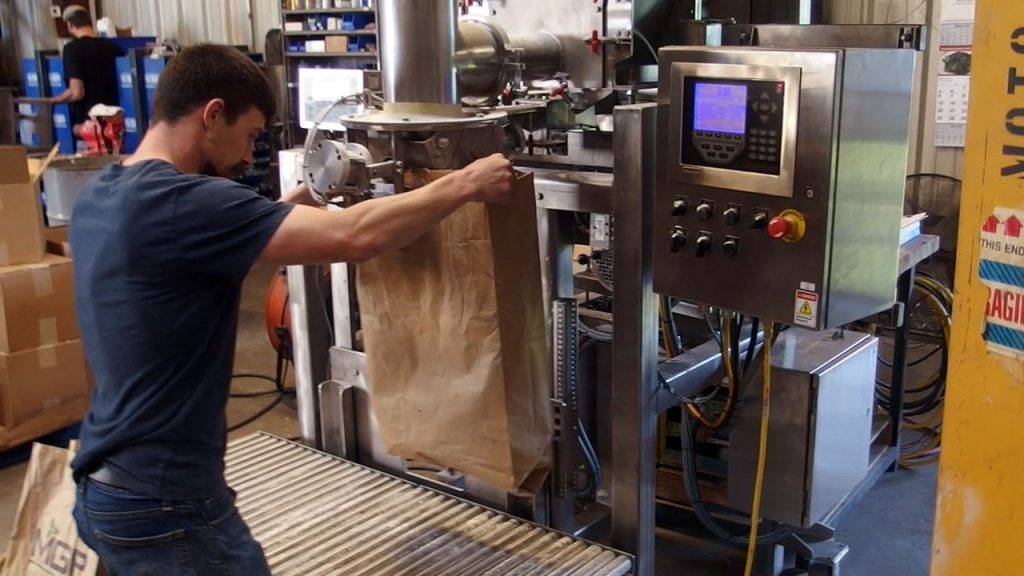 Filling 50 lb Bags with Corn and Wheat Flour using an Auger Filler