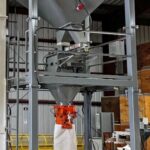 100 cubic foot hopper over simplex net weigh bagging scale with vibratory feeders