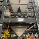 100 cubic foot stainless steel hopper above duplex net weigh bagging scale