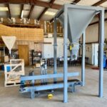 25 cubic foot bagger supply hopper and bag filling and sewing system