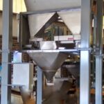 37 cubic foot stainless steel hopper above small net weigh bagging scale