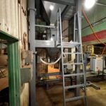 50 cubic foot hopper with mezzanine and ladder above net weigh bagging scale