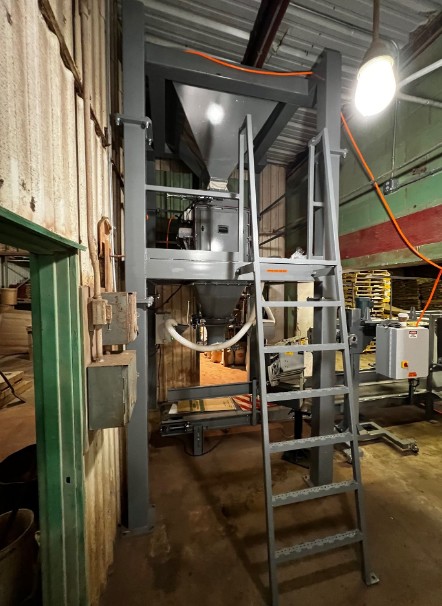 50 cubic foot hopper with mezzanine and ladder above net weigh bagging scale