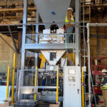 hopper above net weigh bagger and automatic bag placer