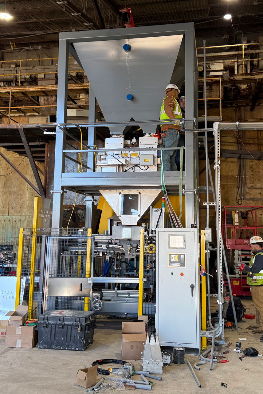 hopper above net weigh bagger and automatic bag placer