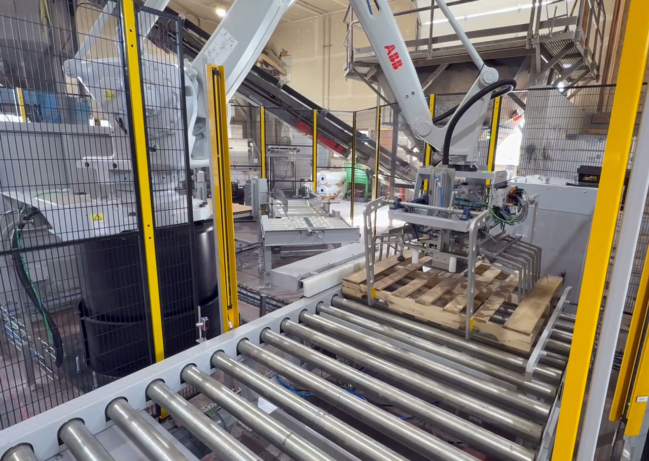 ABB robot places an empty pallet in the bag stack zone