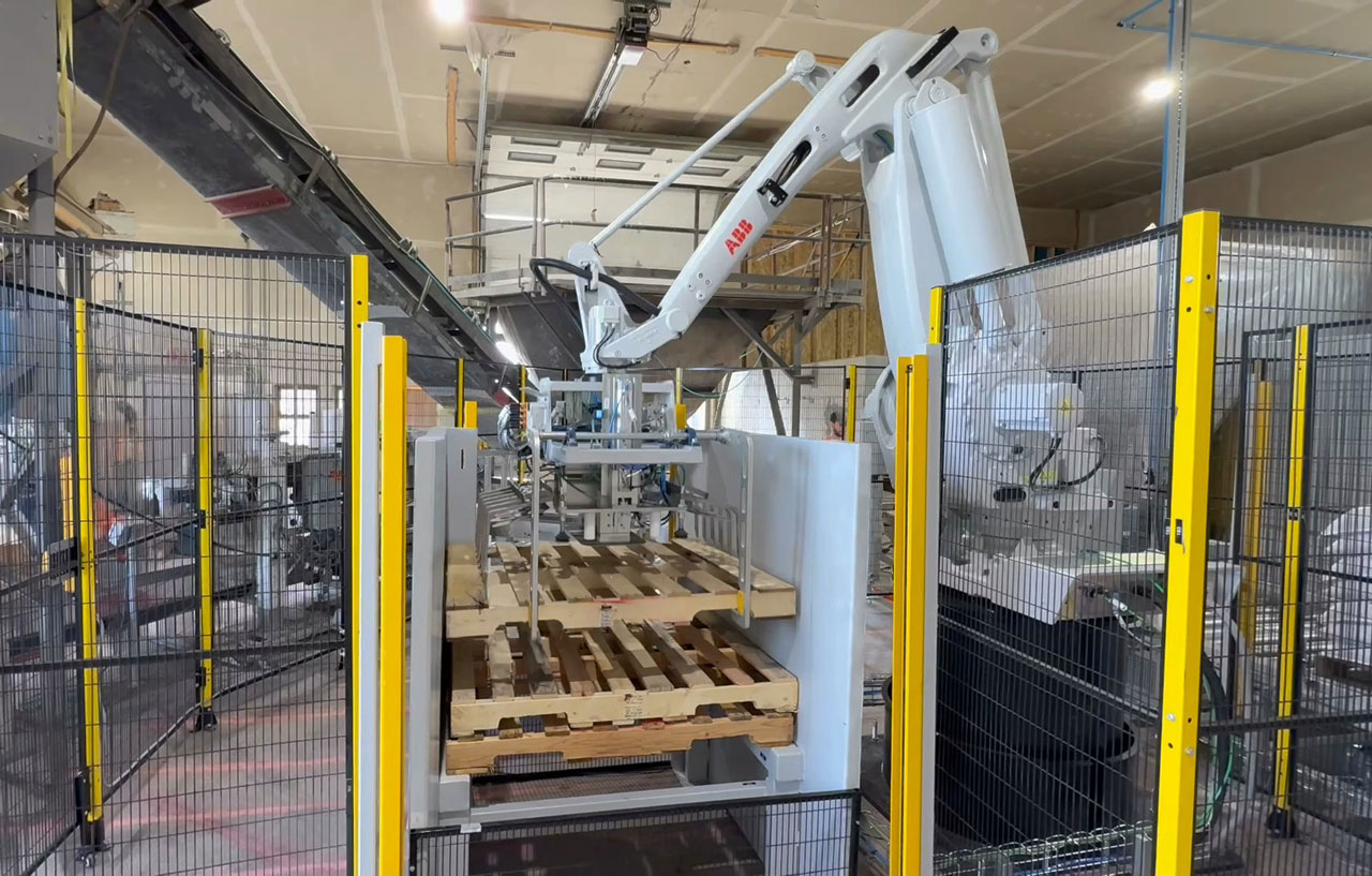 ABB robot retrieving an empty pallet from stack